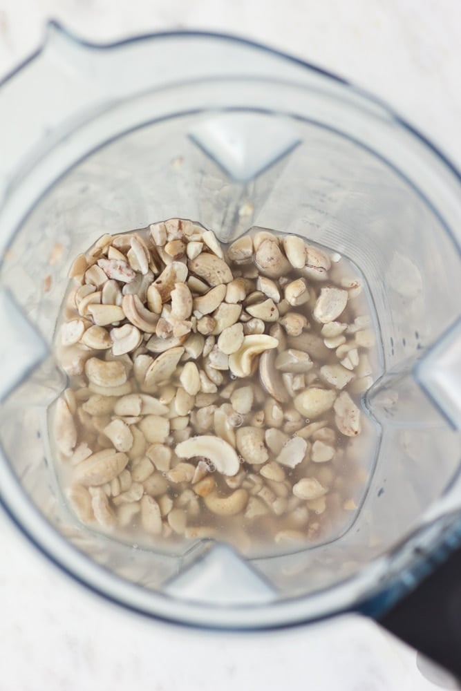 cashews and water in blender, not blended yet for vegan green goddess dressing.