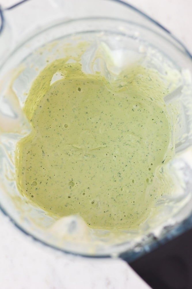 Vegan green goddess dressing in a blender.