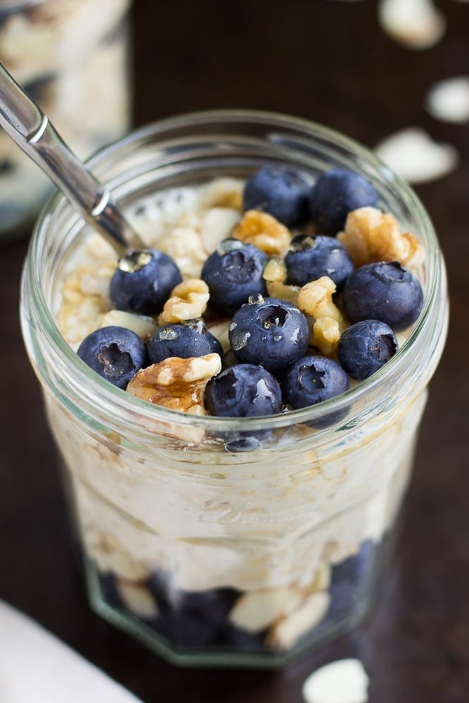 jar of vegan overnight oats with blueberries and walnuts