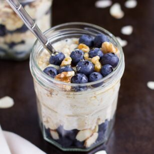 jar of vegan overnight oats with blueberries and walnuts