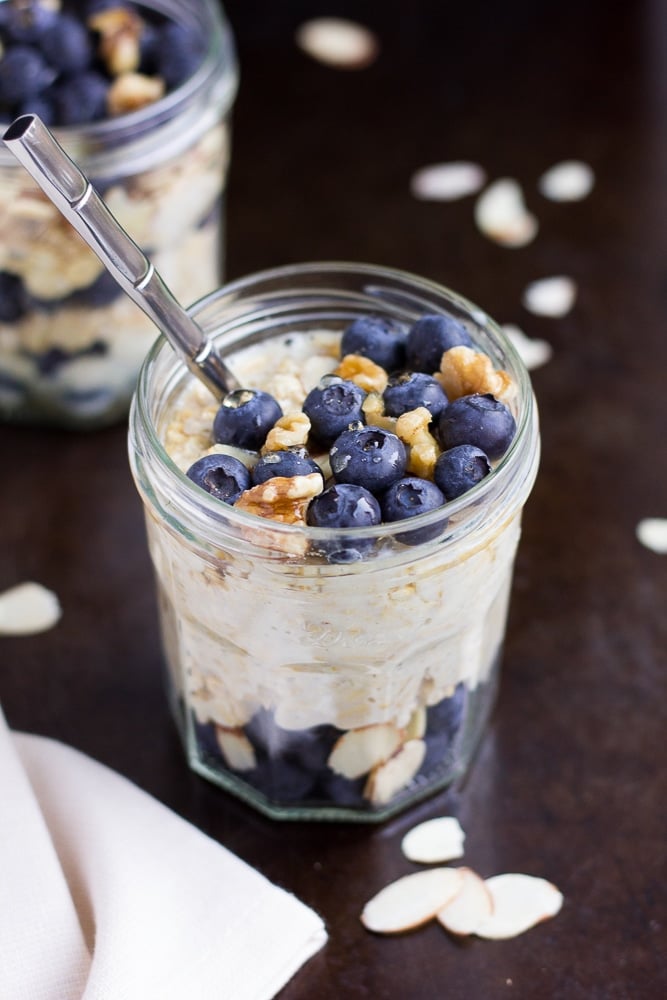 jar of vegan overnight oats with blueberries and walnuts