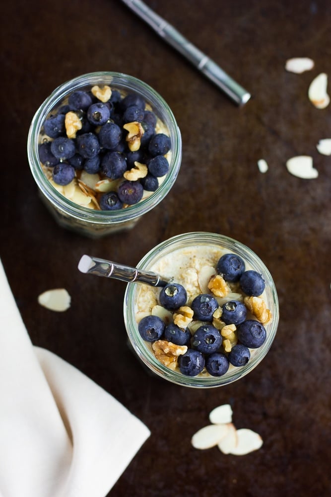 jar of vegan overnight oats with blueberries and walnuts from the top