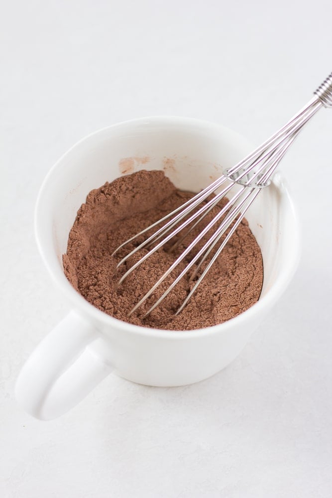 dry ingredients whisked in a mug for vegan mug cake