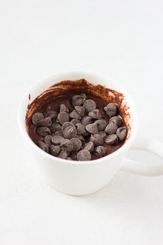 uncooked chocolate vegan mug cake in a mug