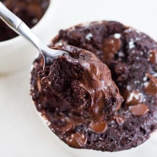 chocolate vegan mug cake with a spoonful taken out