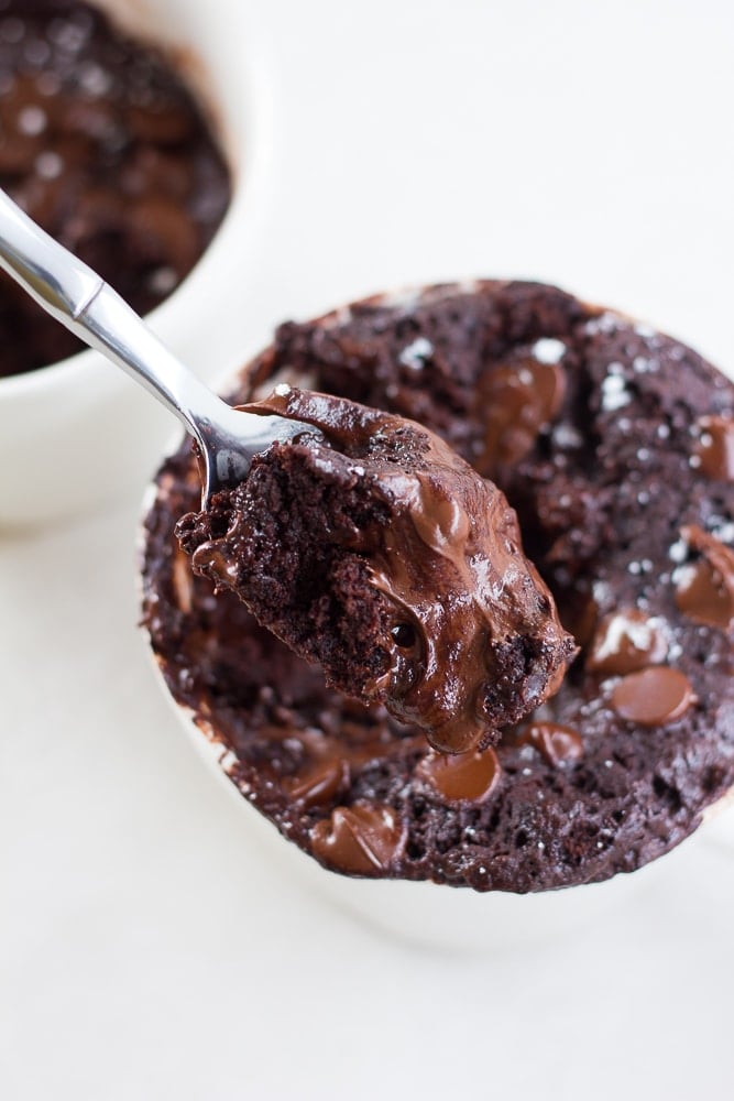 chocolate vegan mug cake with a spoonful taken out