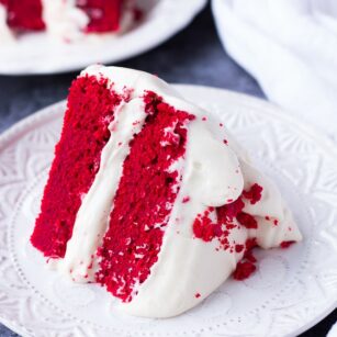 slice of vegan red velvet cake on a plate