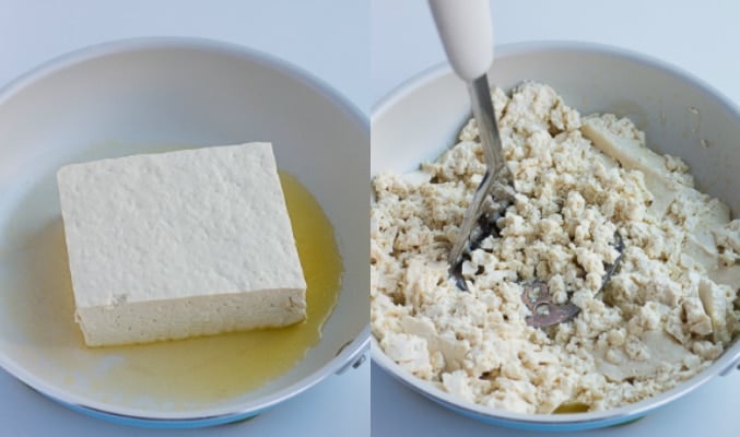 block of tofu in pan, then being pressed to crumble it for tofu scramble