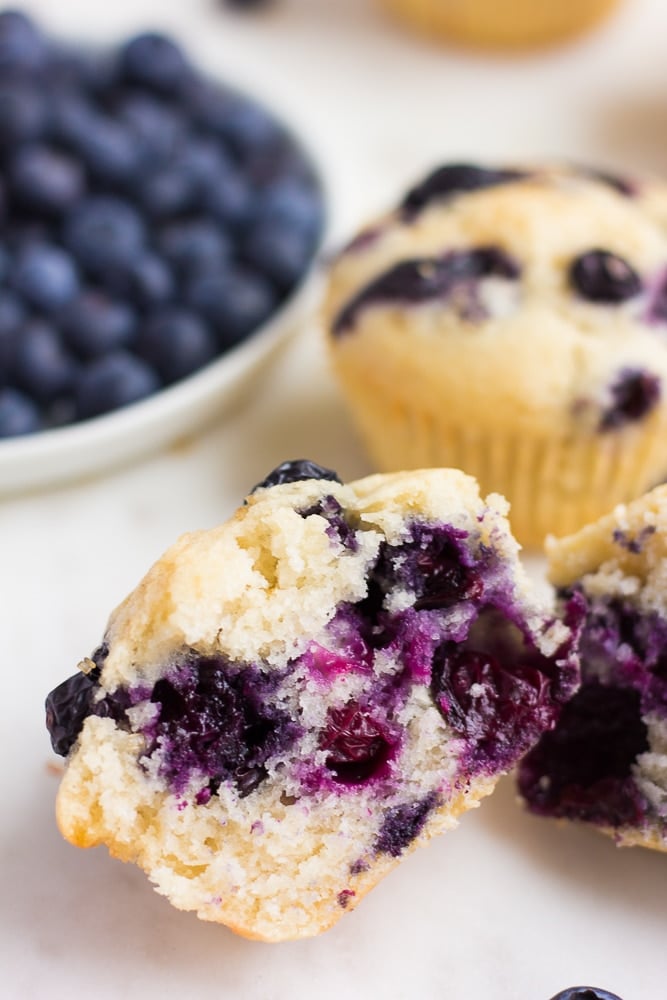 vegan blueberry muffin cut in half to show insides