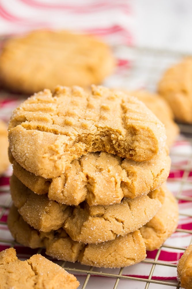 stack of 4 cookies, a bite taken out of the top one