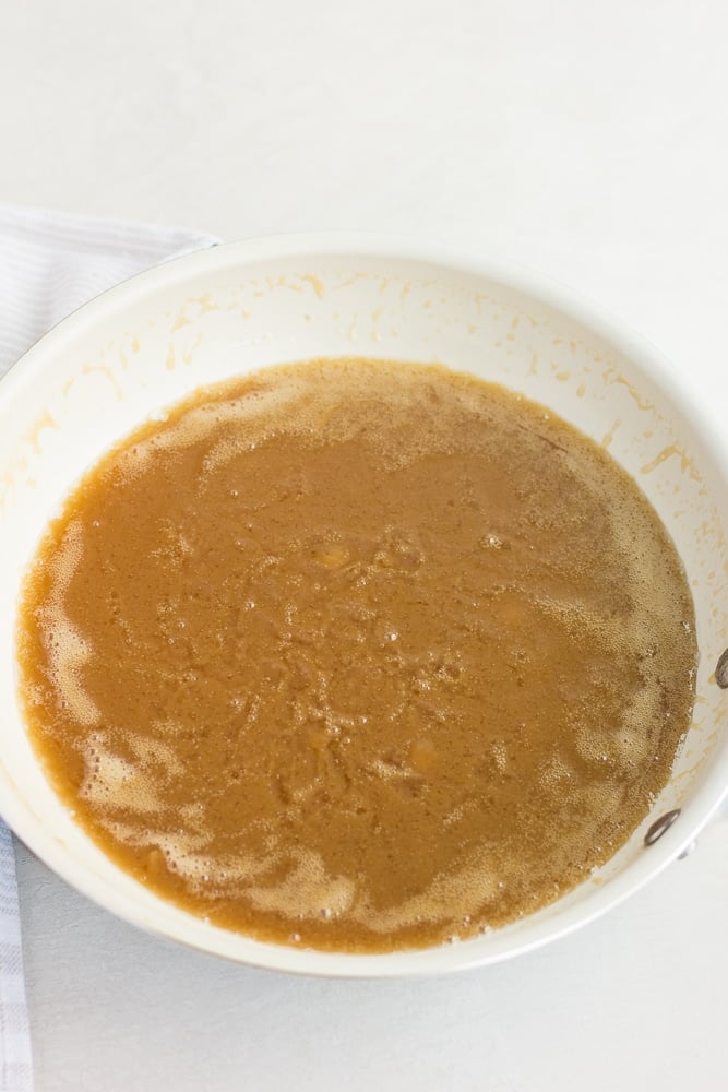 showing vegan caramel cooking in pan.