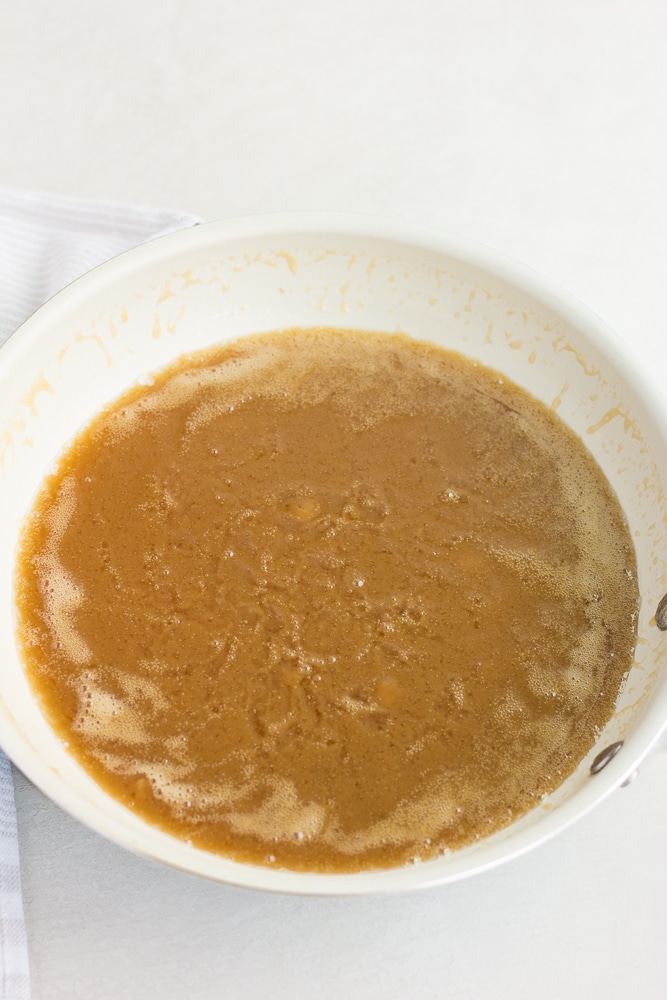 showing vegan caramel cooking in pan.