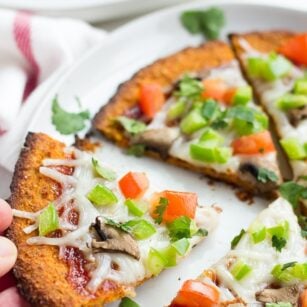 whole sweet potato pizza crust pizza on a plate.