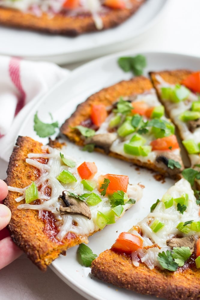 whole sweet potato pizza crust pizza on a plate.