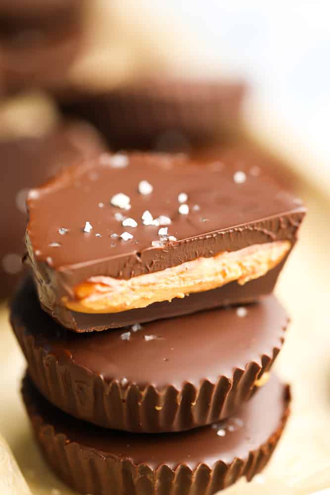stack of vegan peanut butter cups, bite taken out close up