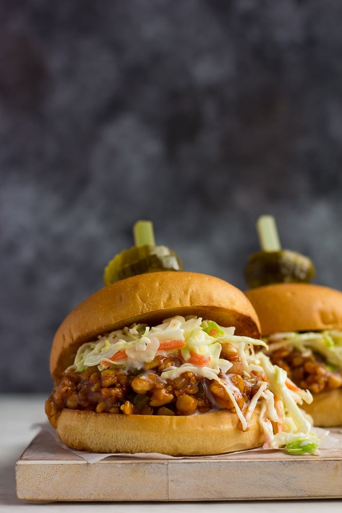 bbq tempeh sandwich with pickles on top