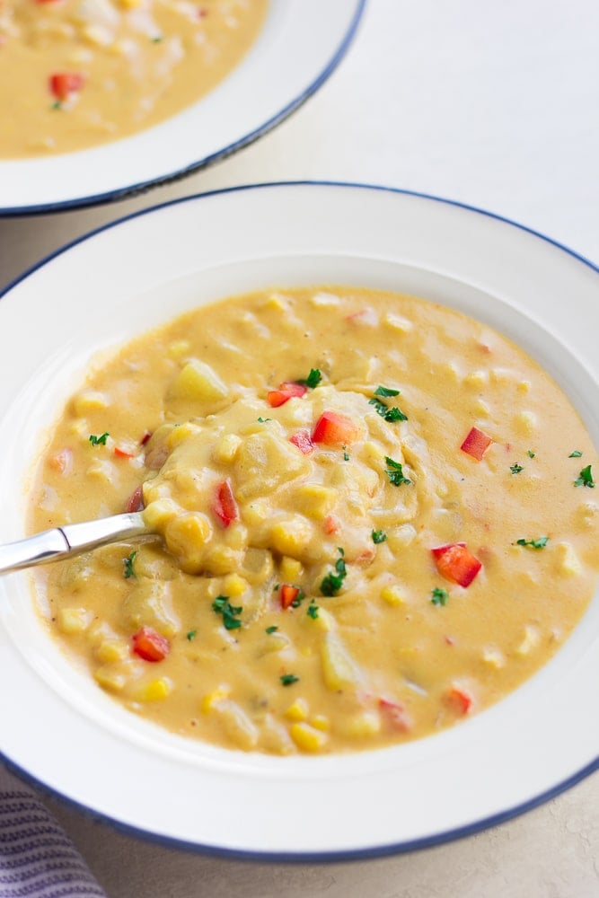 white bowl filled with vegan corn chowder.