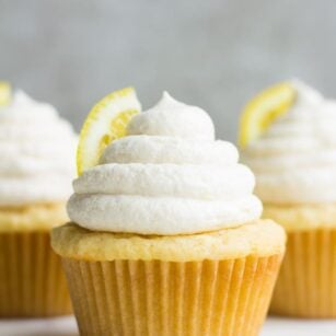 straight on photo of 3 vegan lemon cupcakes