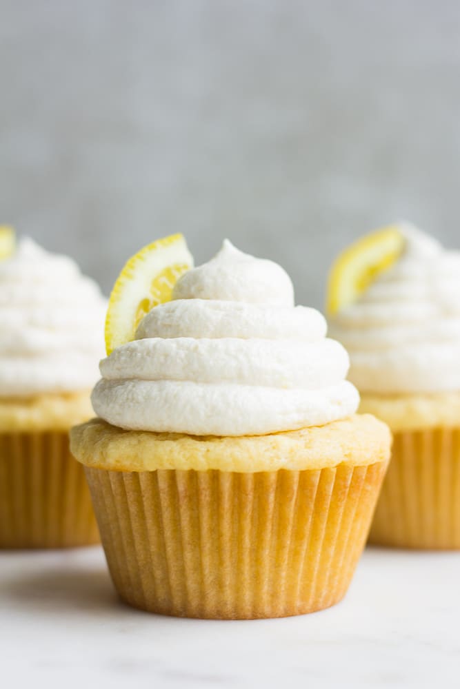 straight on photo of 3 vegan lemon cupcakes