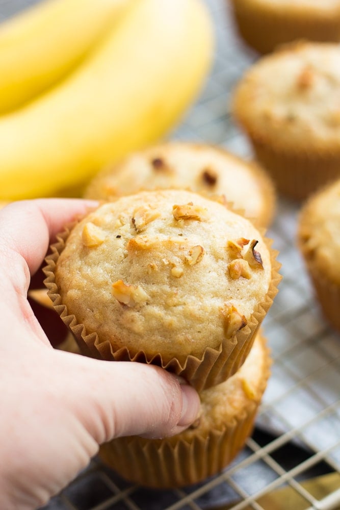 hand grabbing a vegan banana muffin.