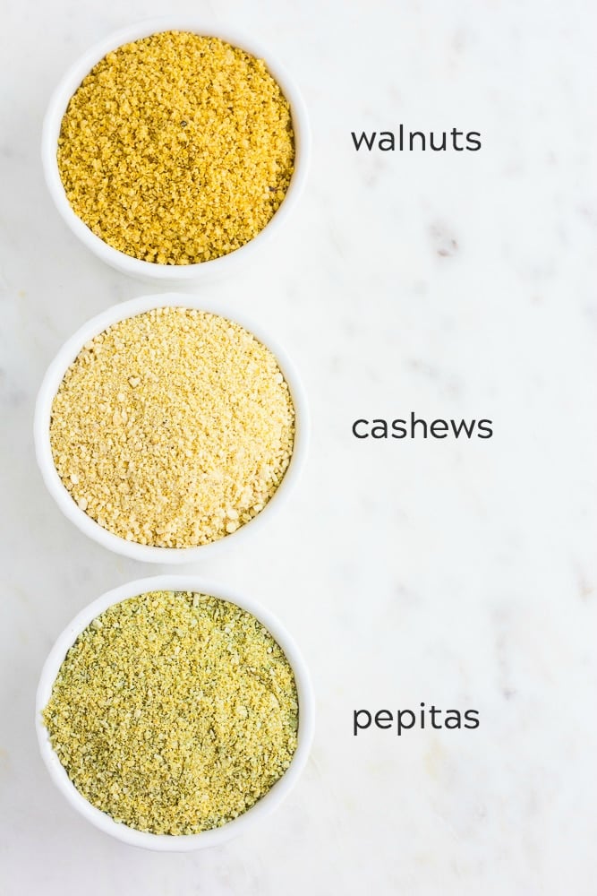 vegan parmesan cheese 3 ways in bowls -walnuts, cashews and pepitas.