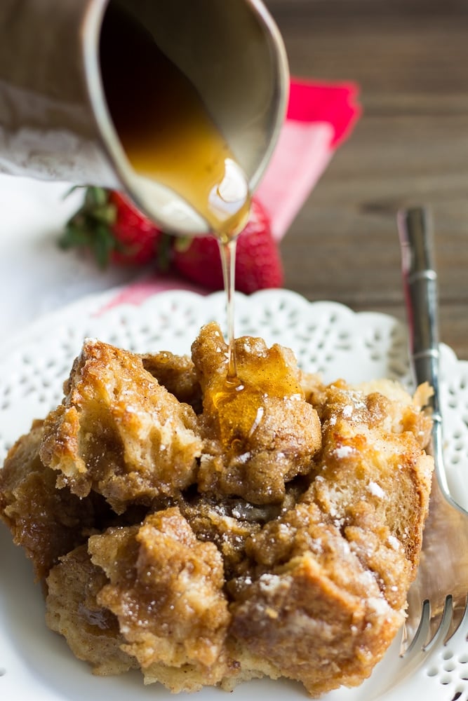 plate with french toast casserole and maple syrup drizzle