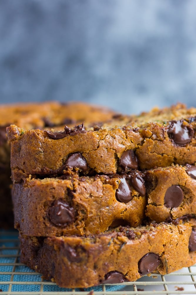 close up side photo of vegan zucchini bread with chocolate chips.