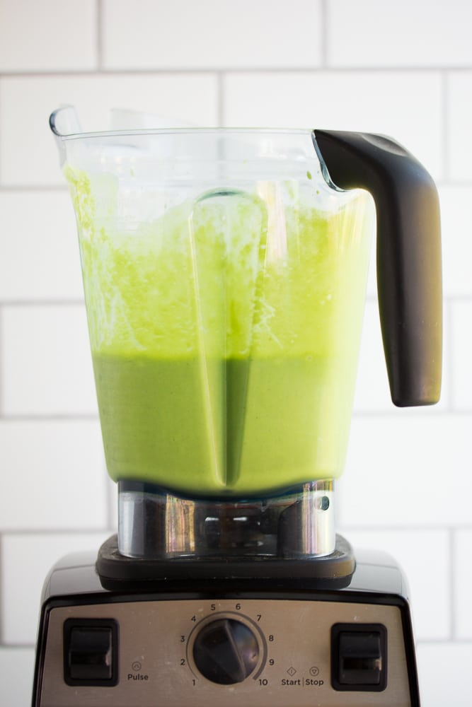 blender full of vegan green smoothie, blended.