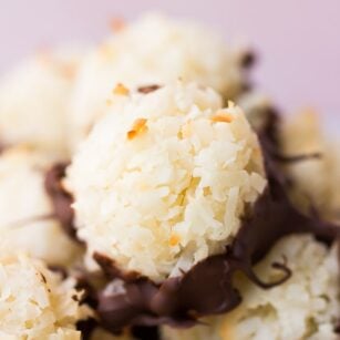 close up of vegan coconut macaroons with pink background.