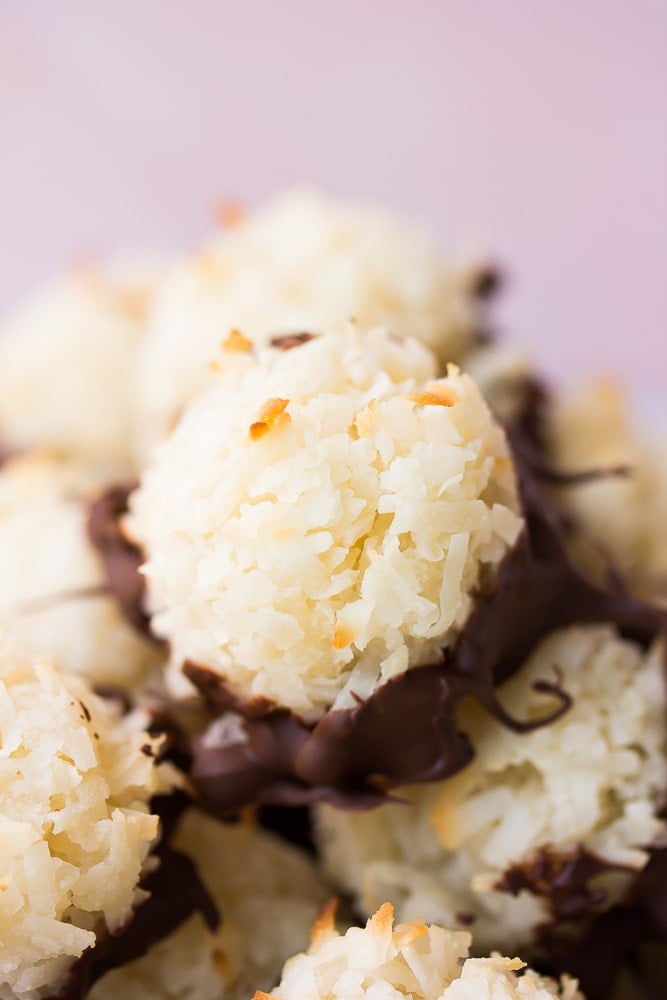 close up of vegan coconut macaroons with pink background.