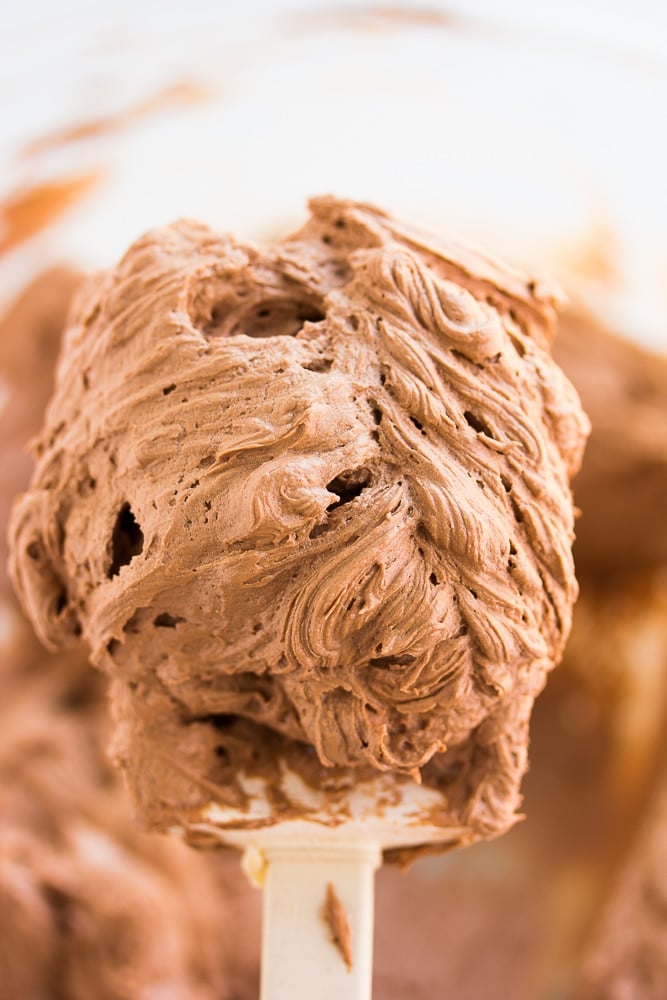 chocolate frosting on a spatula, close up.