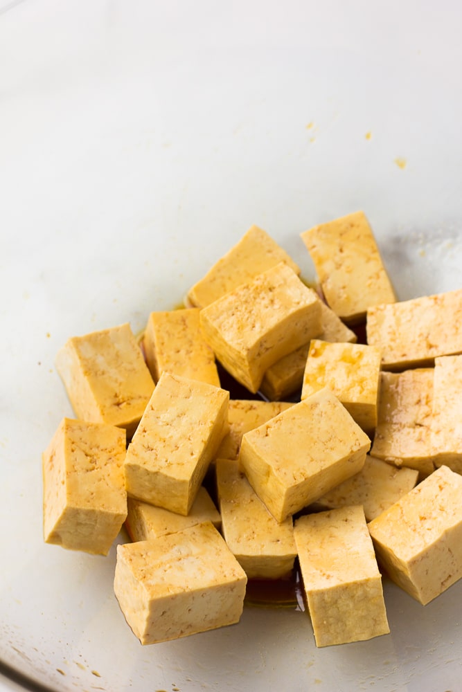 marinating tofu for air fryer tofu in a clear bowl