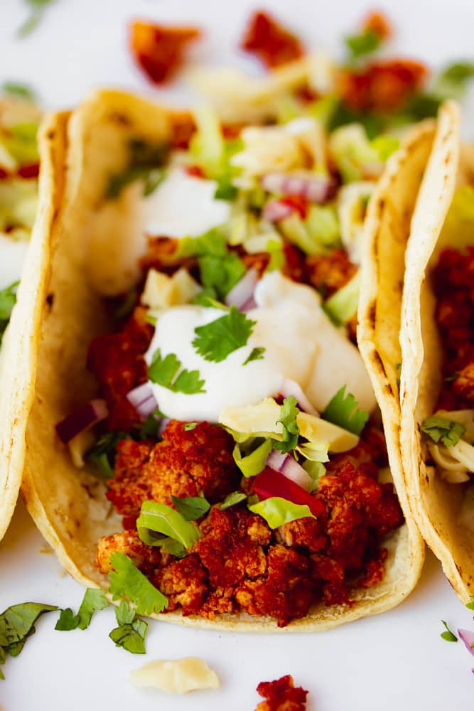 tofu tacos in a row, close up on the middle one