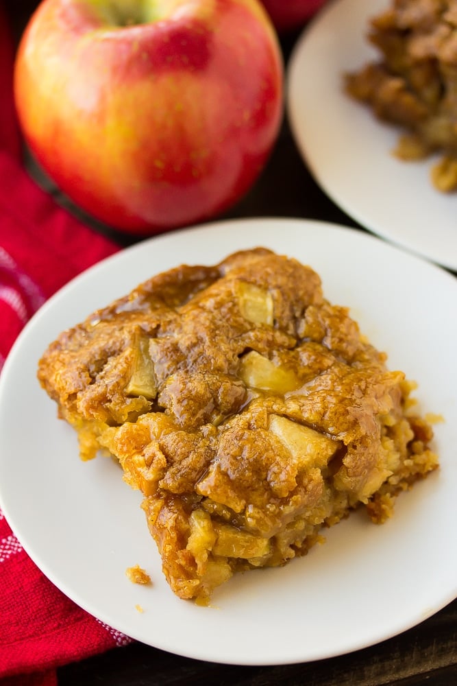 slice of vegan apple cake with apple and red towel