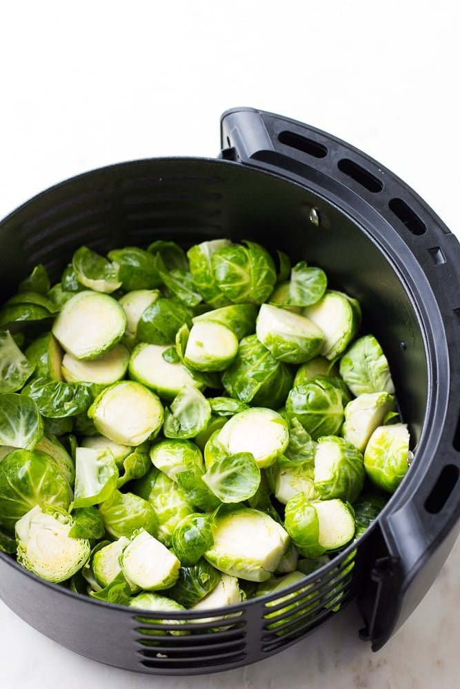 uncooked brussels sprouts in an air fryer