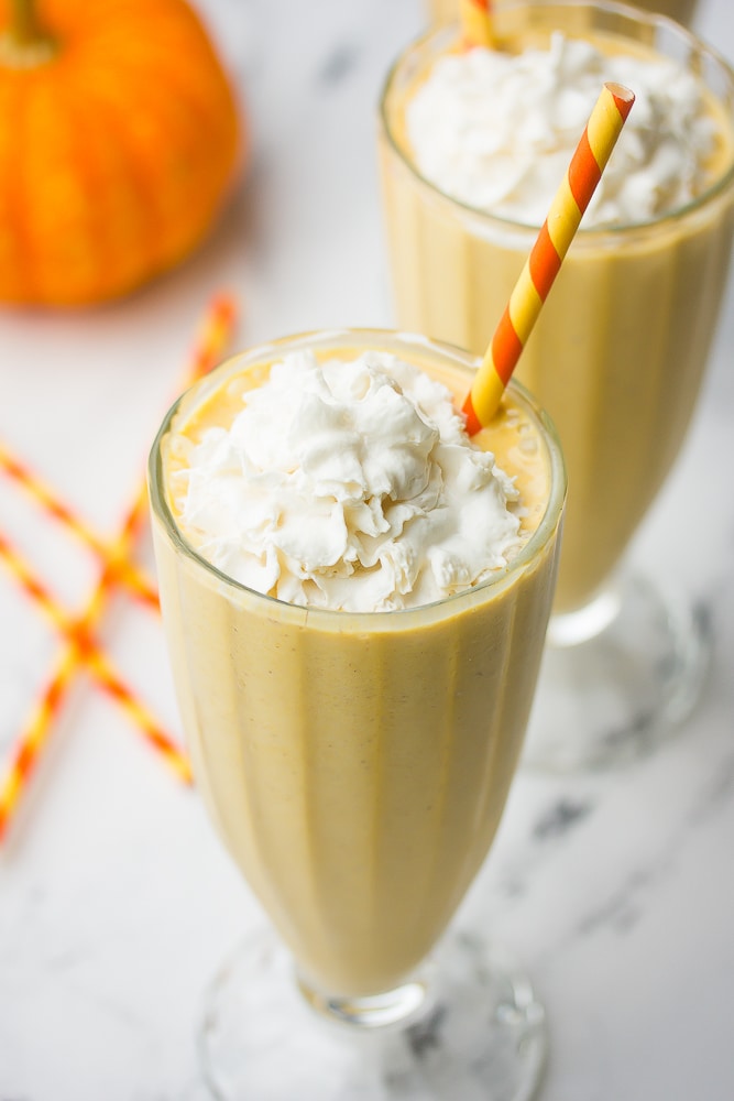 2 vegan milkshakes with whipped cream and straws