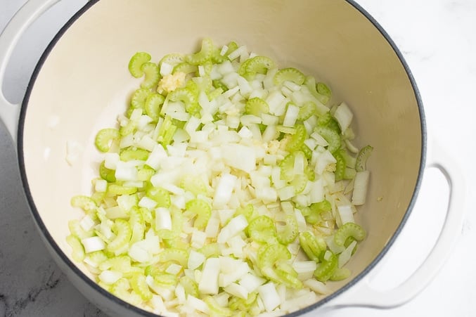 celery and onions in a pot being cooked