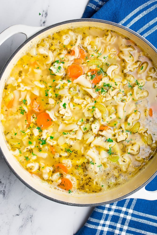 large pot of soup with noodles