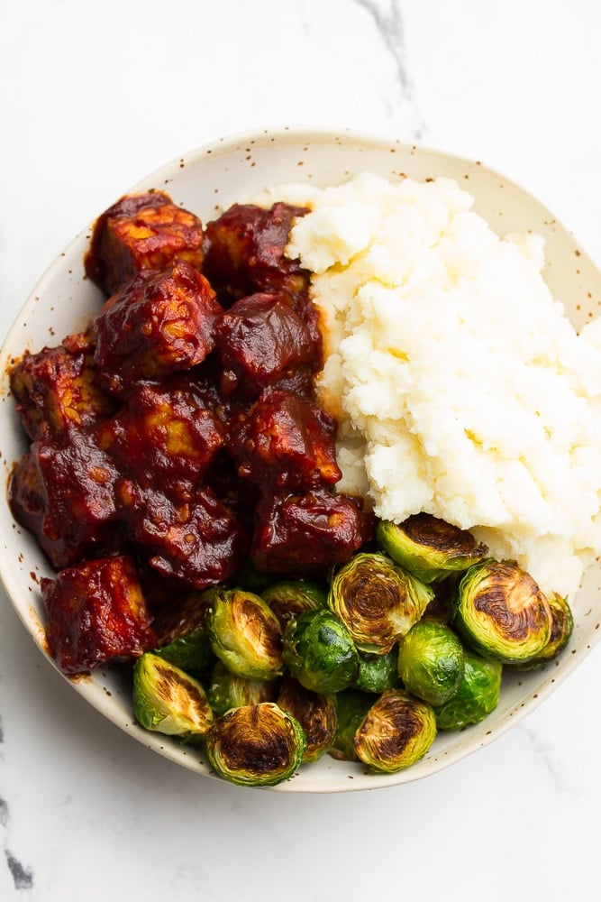 bowl with bbq tempeh, brussels and potatoes