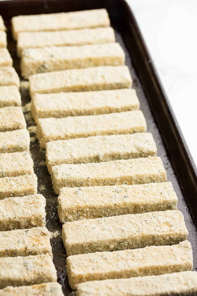 coated tofu sticks on pan