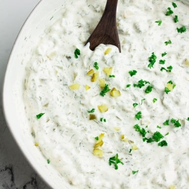 vegan tartar sauce sprinkled with parsley in a bowl
