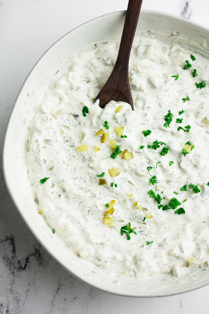 vegan tartar sauce sprinkled with parsley in a bowl