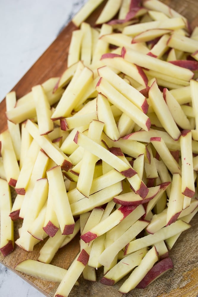 cut potatoes not yet cooked in a pile