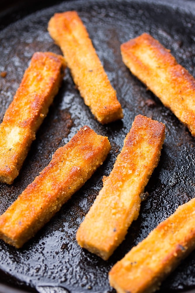 frying tofu sticks on a pan