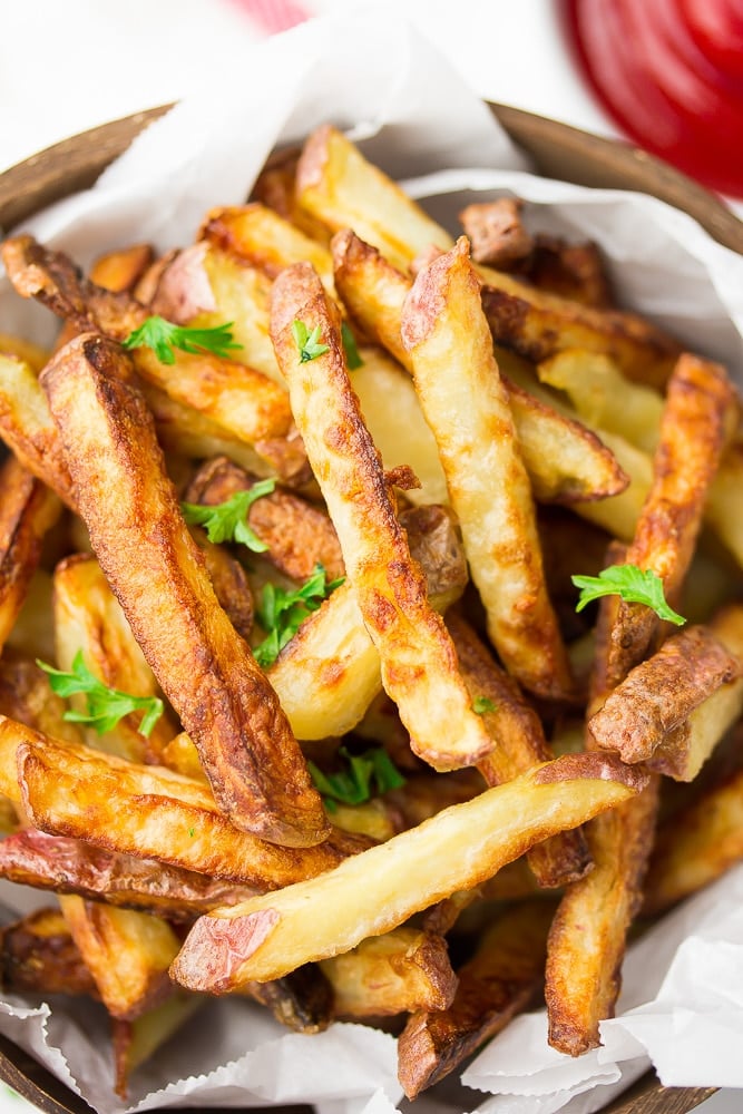 crispy fries on a plate with parsley