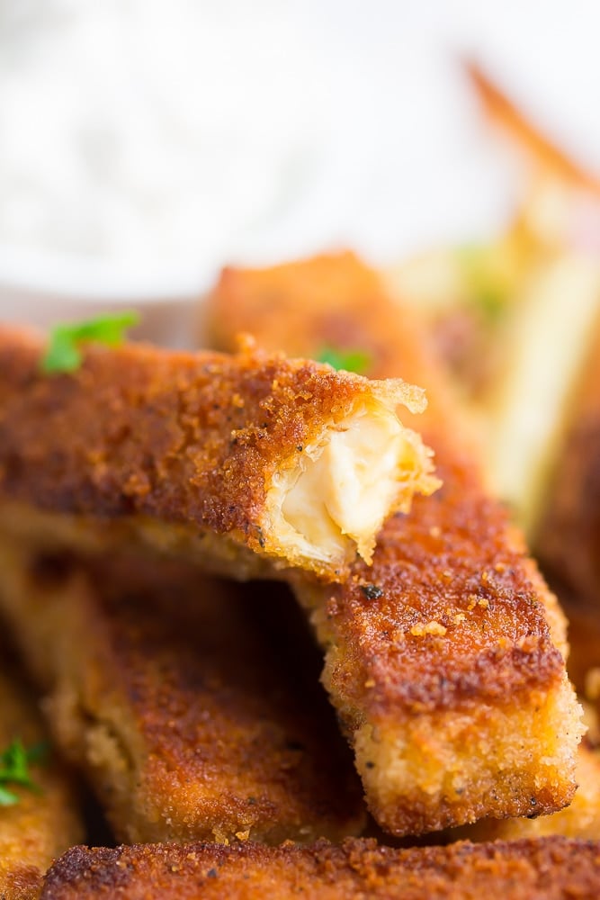 fried tofu fish with a bite taken out of it