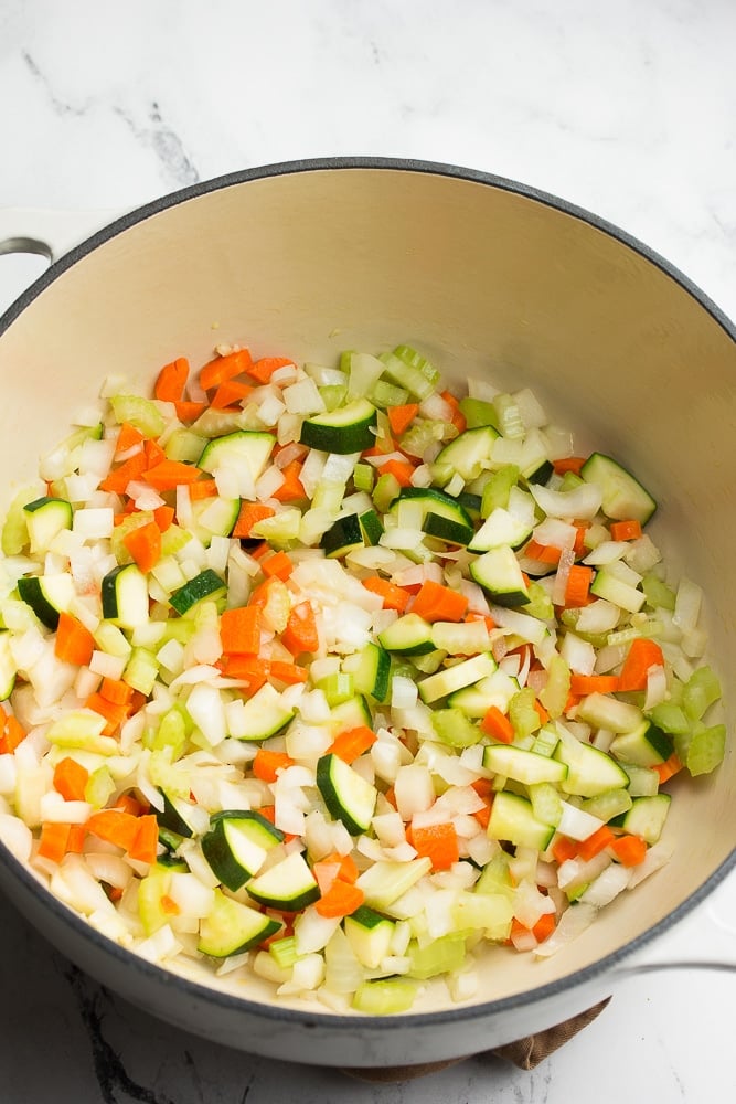 sauteeing vegetables in a large soup pot.