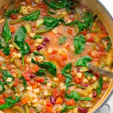 whole pot of minestrone soup, green spinach, white pot