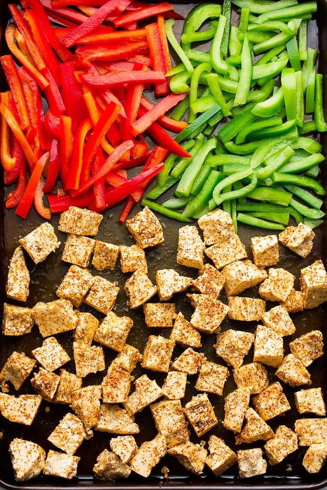 spiced tofu and peppers on sheet pan, not yet cooked