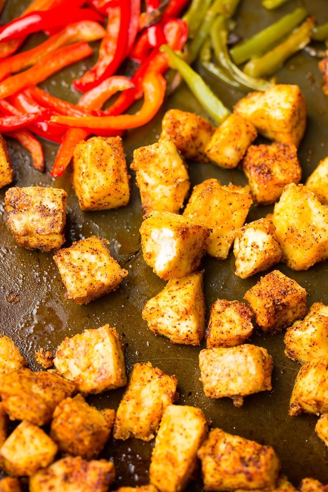 close up of tofu chikn on sheet pan with peppers